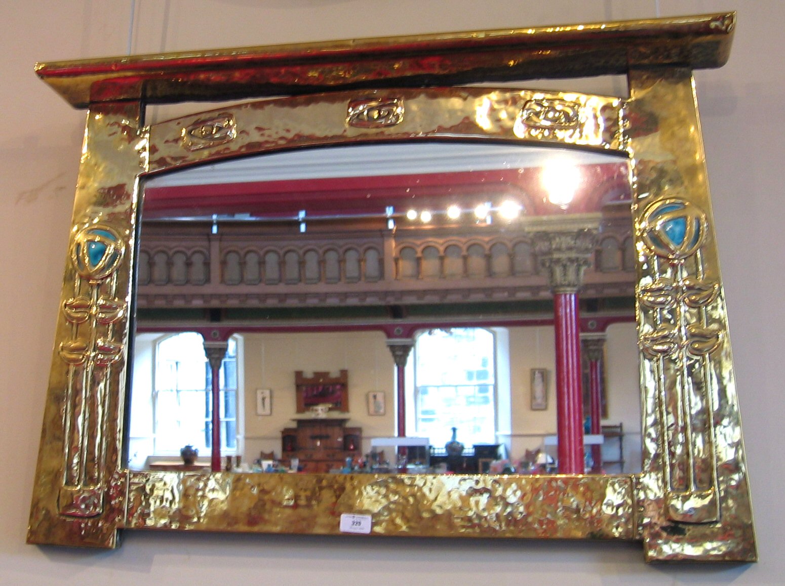 A Scottish School brass framed wall mirror, circa 1900,