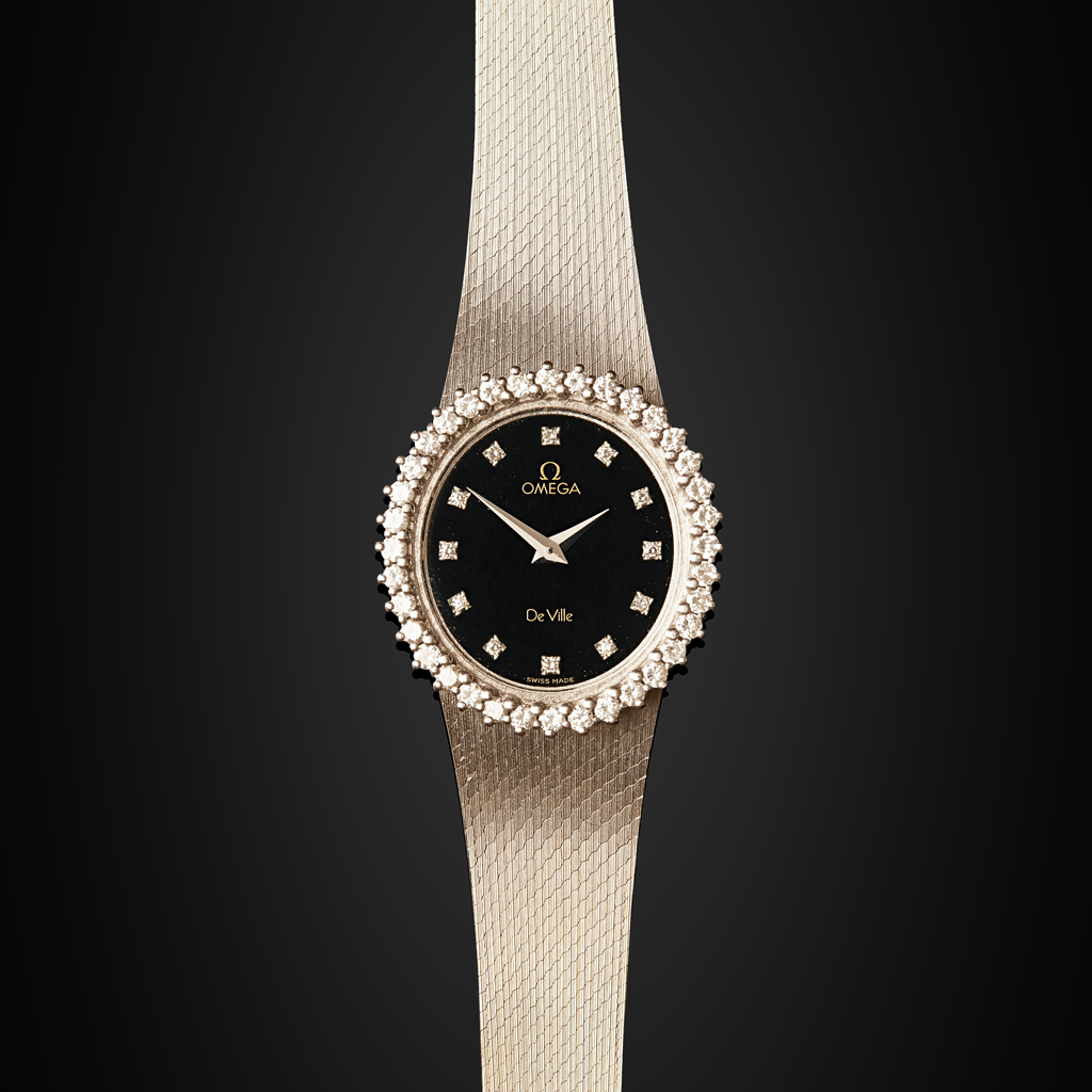 OMEGA - A lady's 18ct gold and diamond set wrist watch