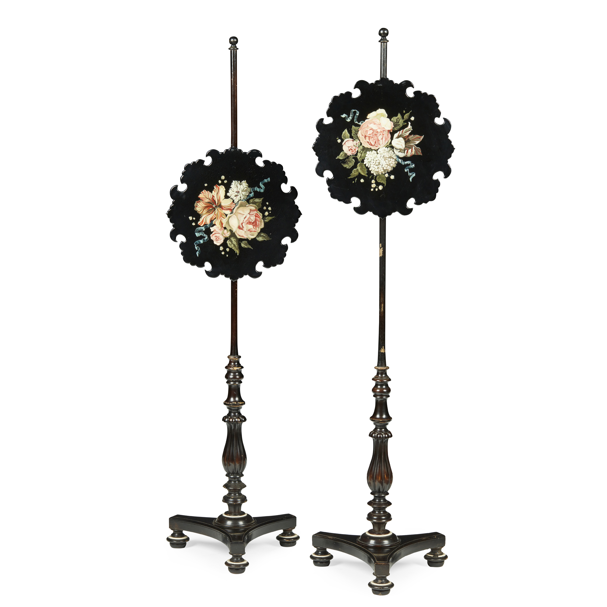 PAIR OF REGENCY EBONISED AND FLOWER PAINTED PAPIER MACHE POLE SCREENS