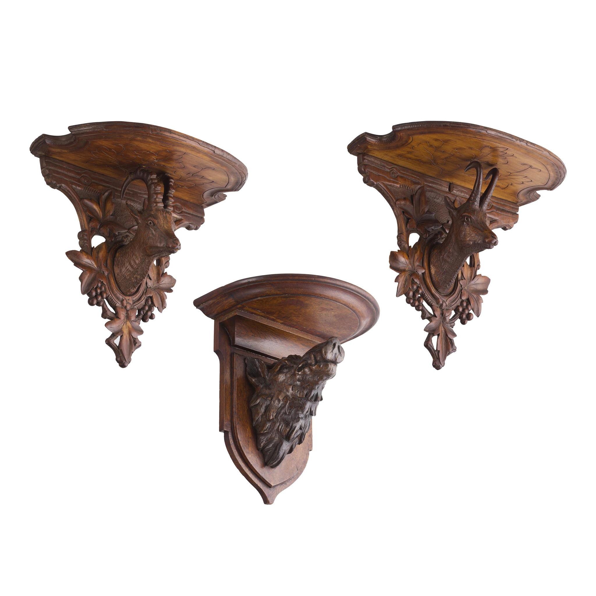 THREE BLACK FOREST CARVED WALL BRACKETS