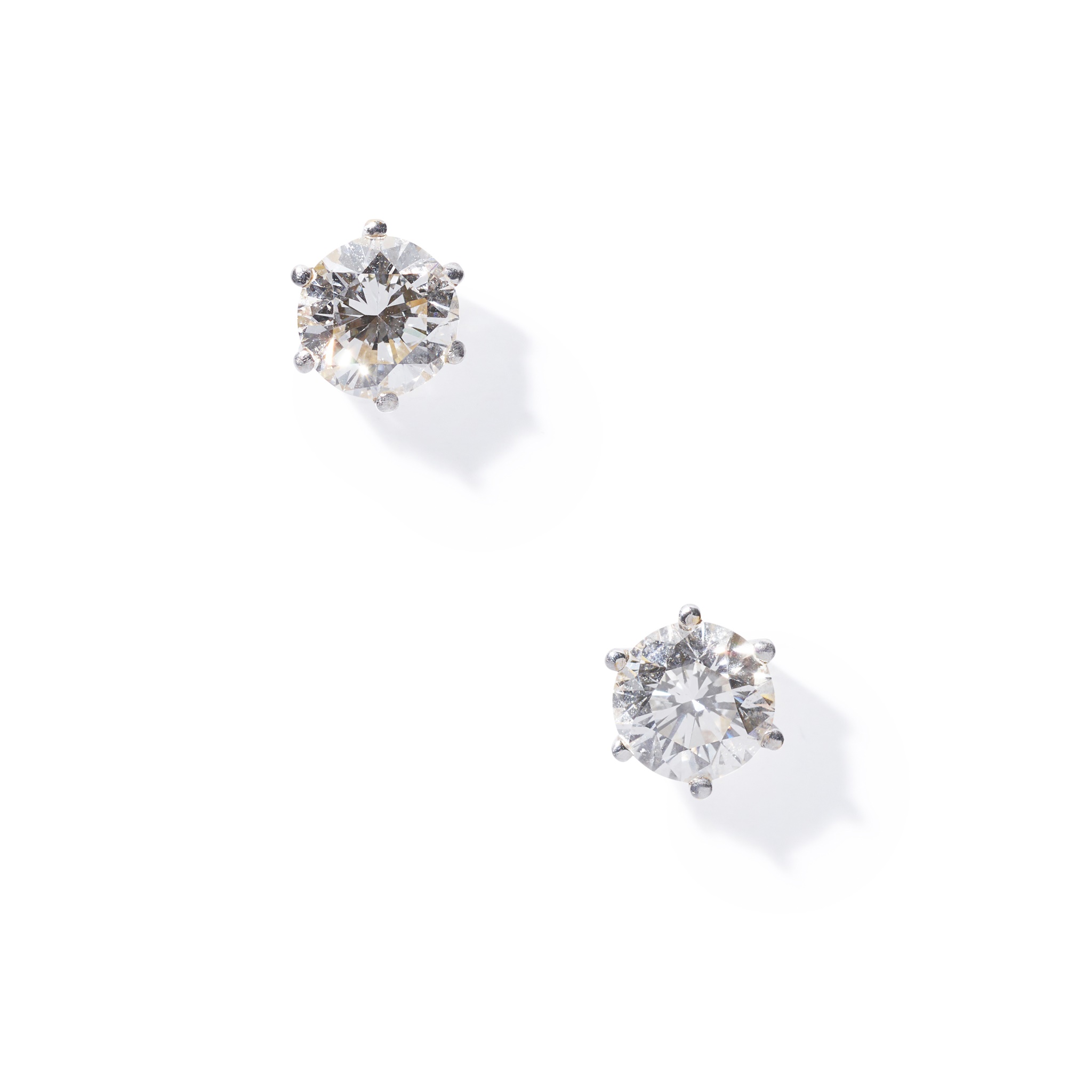 A pair of diamond single-stone earrings