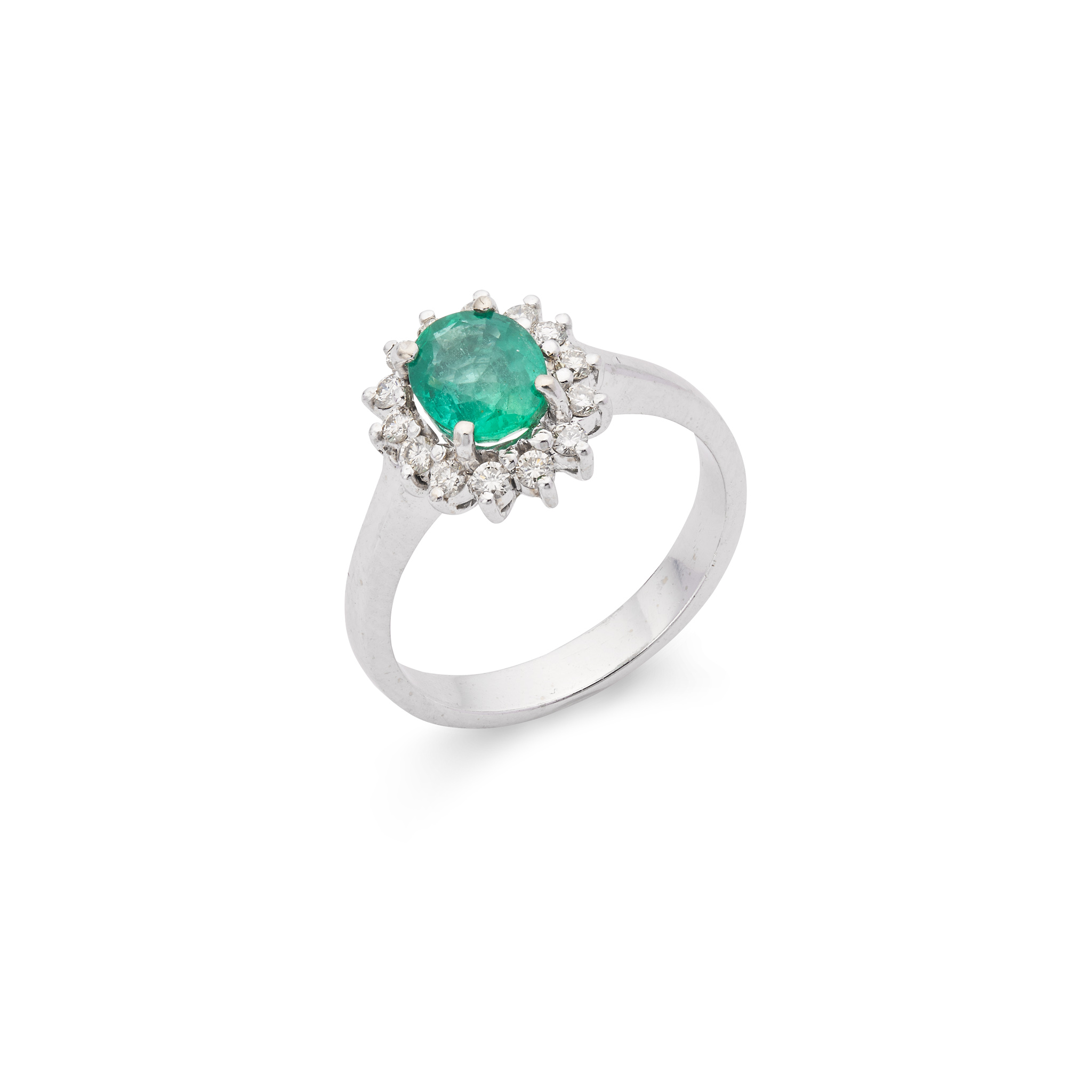 An emerald and diamond cluster ring