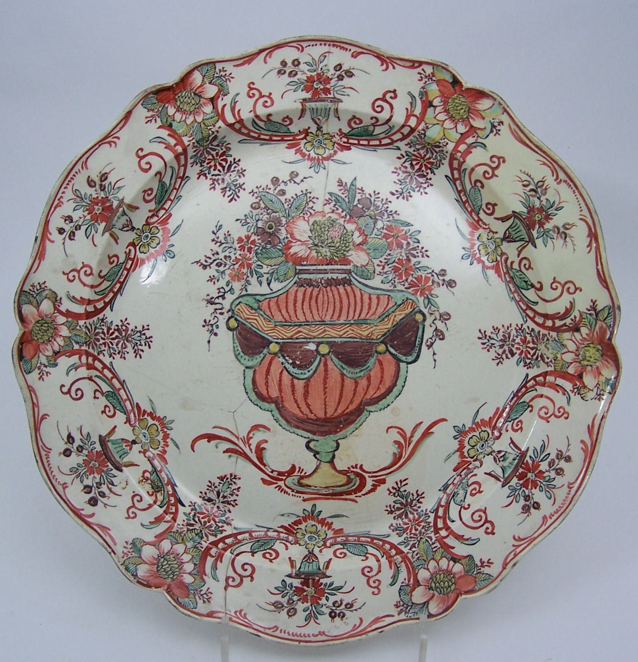 A large circular creamware plate