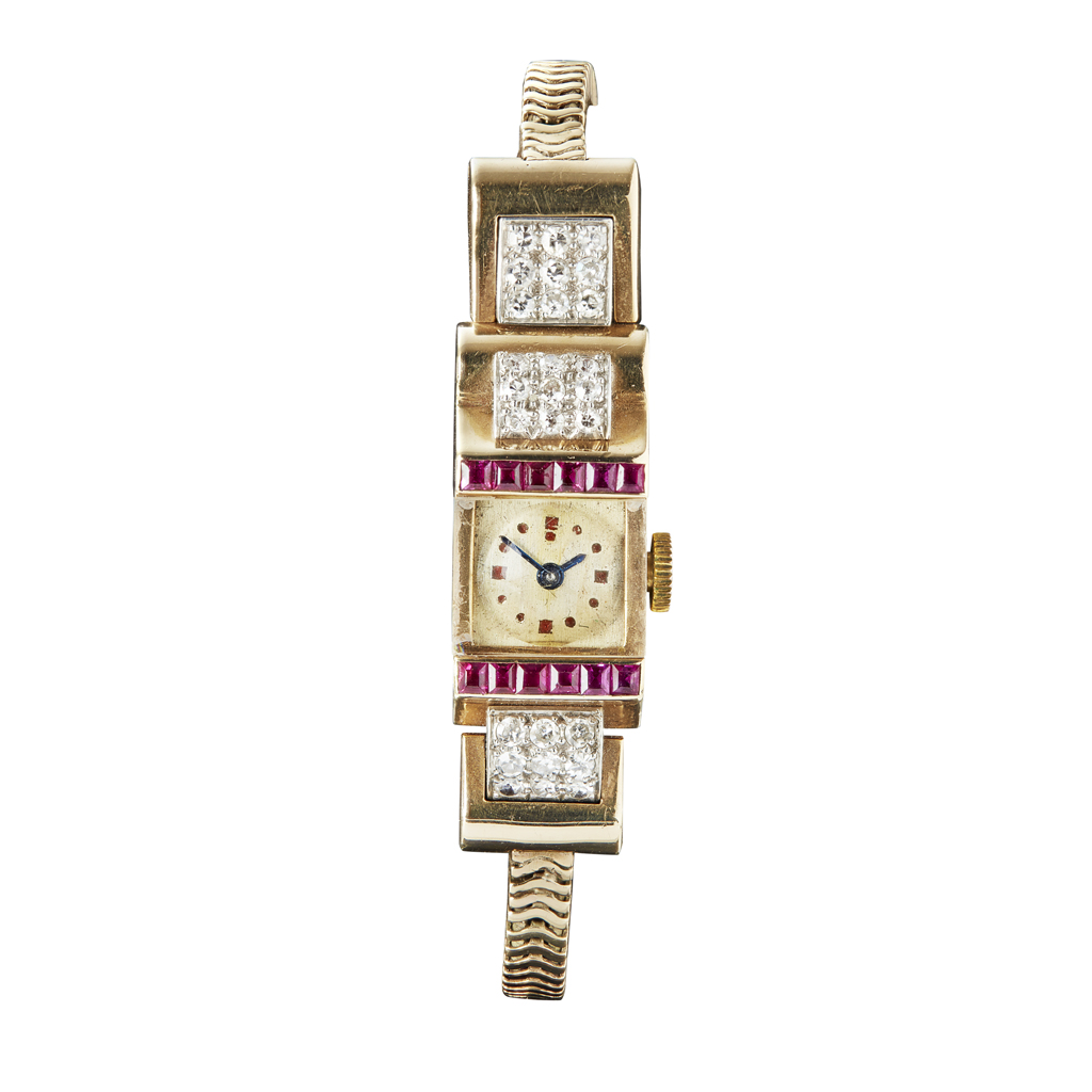 A lady's 9ct gold diamond and ruby set cocktail watch