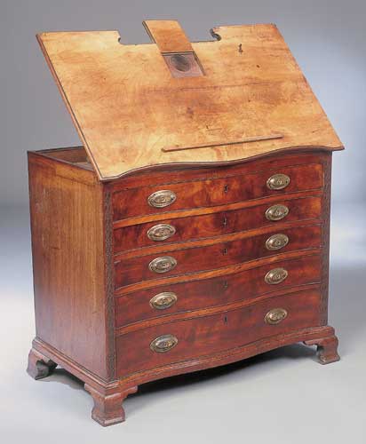 A George II mahogany serpentine architects chest of drawers