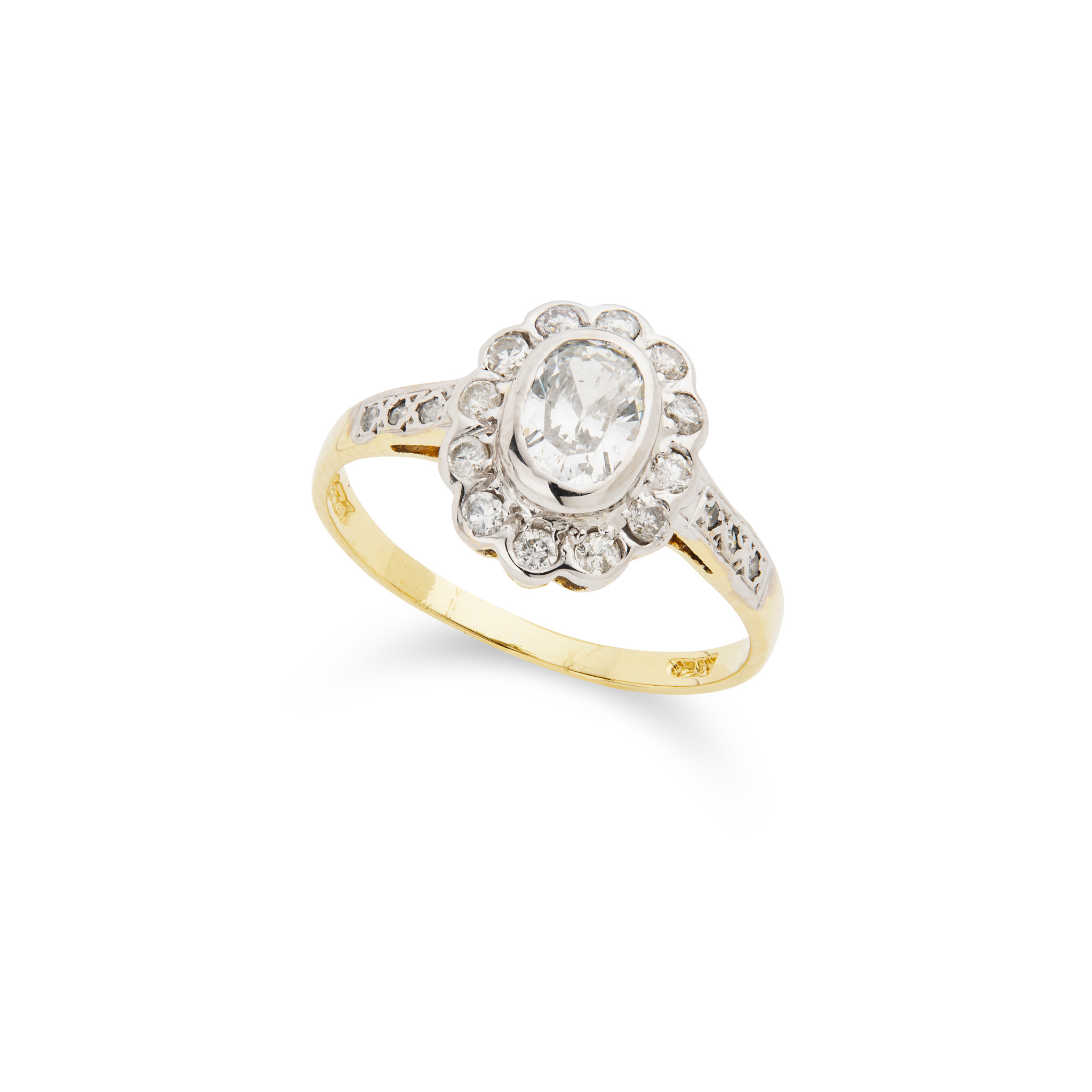 An oval-cut diamond cluster ring, 1988