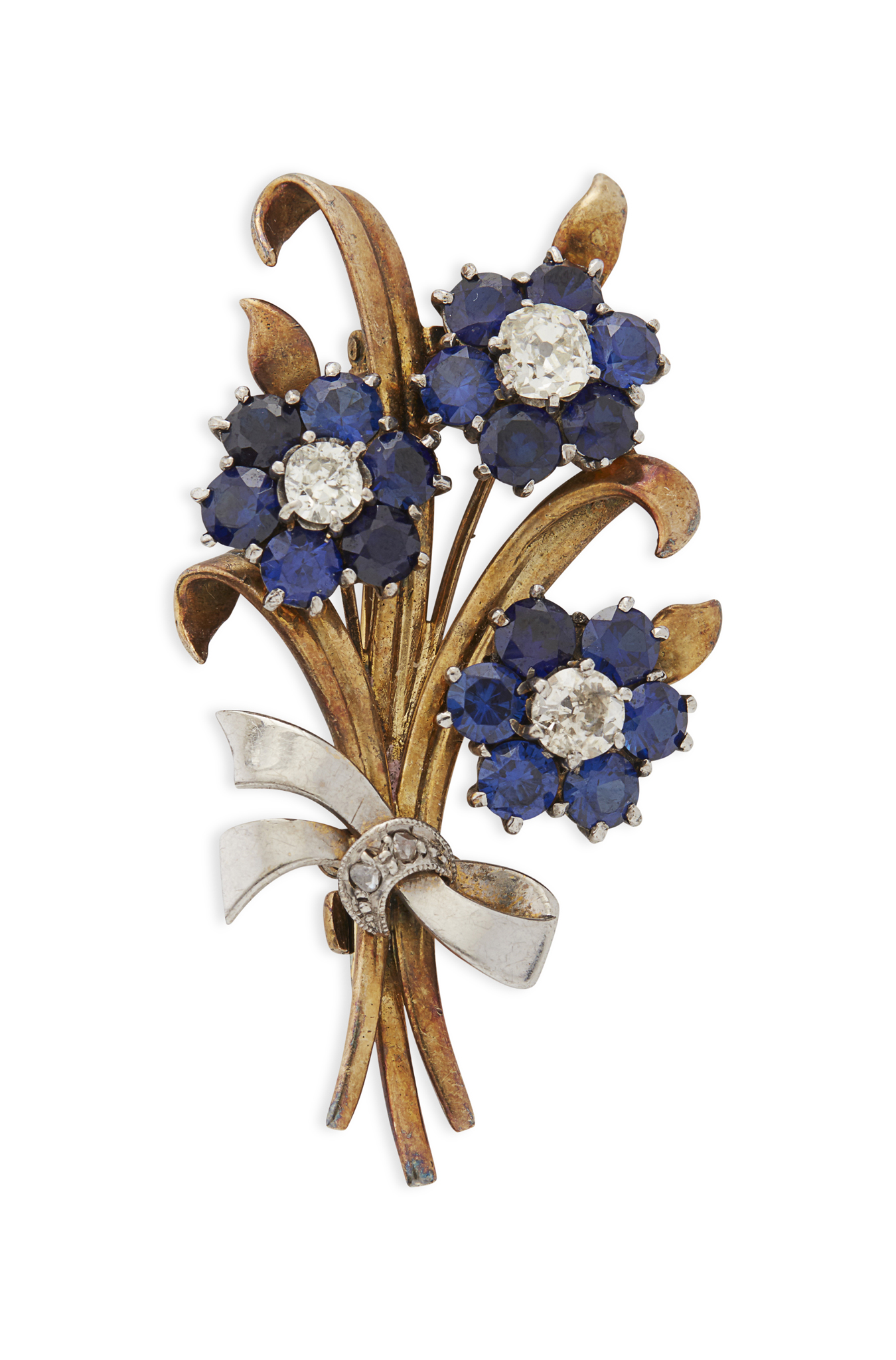 A sapphire and diamond set spray brooch