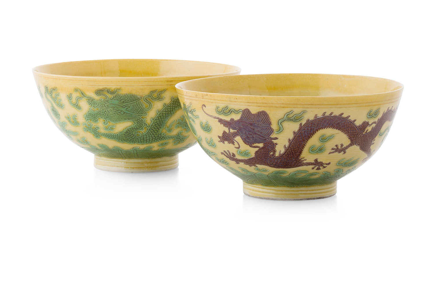 PAIR OF GREEN AND AUBERGINE GLAZE YELLOW GROUND 'DRAGON' BOWLS