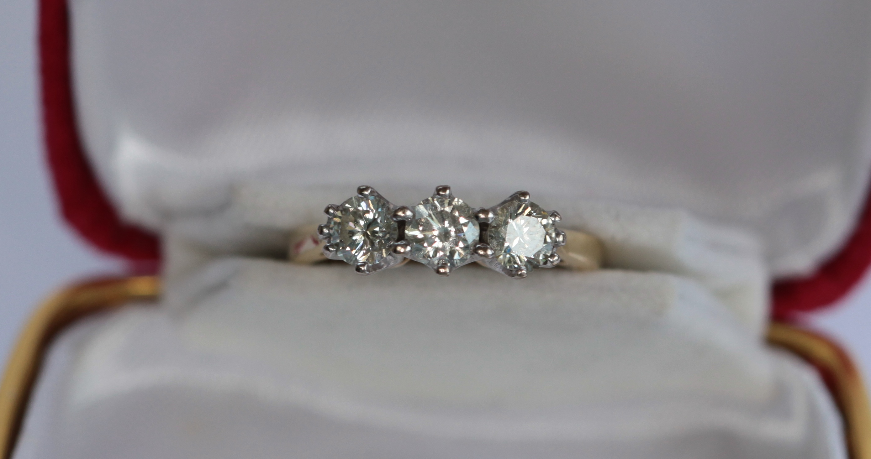 An 18ct gold mounted three-stone diamond ring