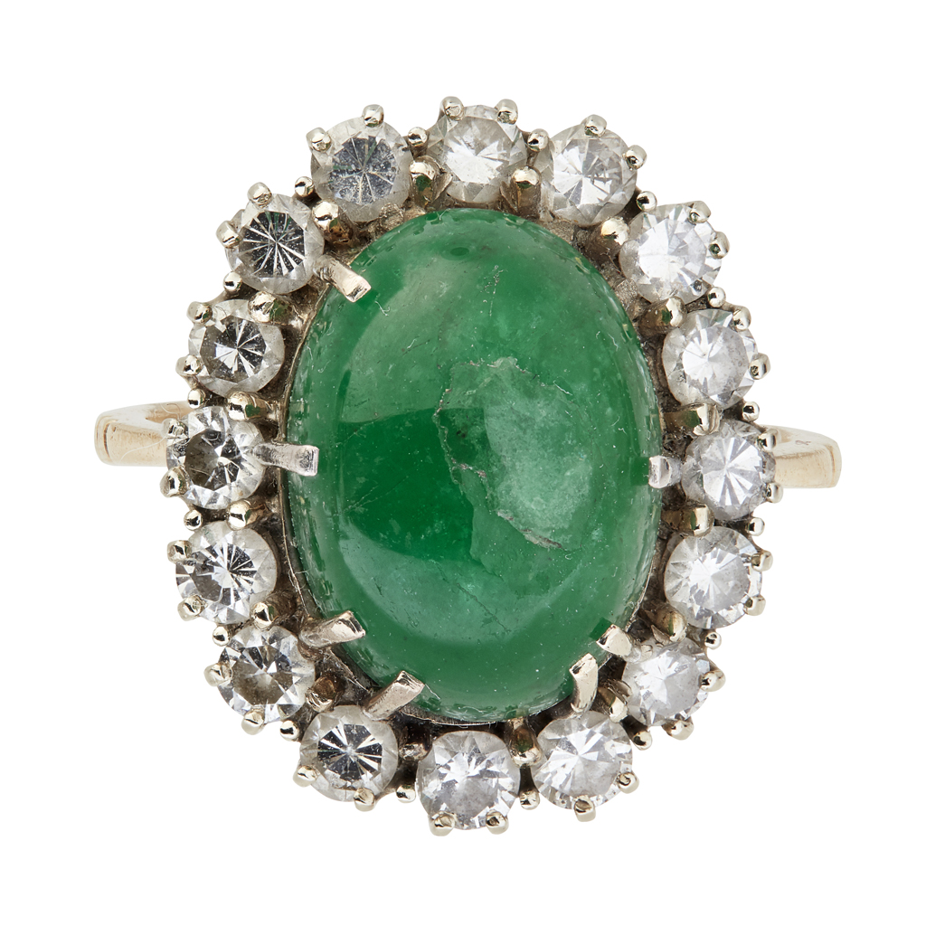 An emerald and diamond set cluster ring