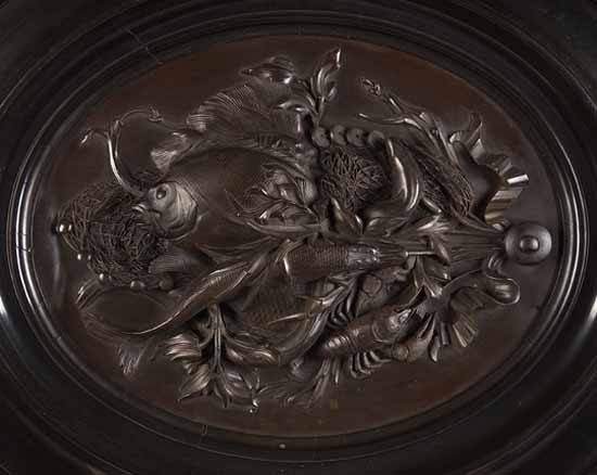 A 19th century bronzed oval panel