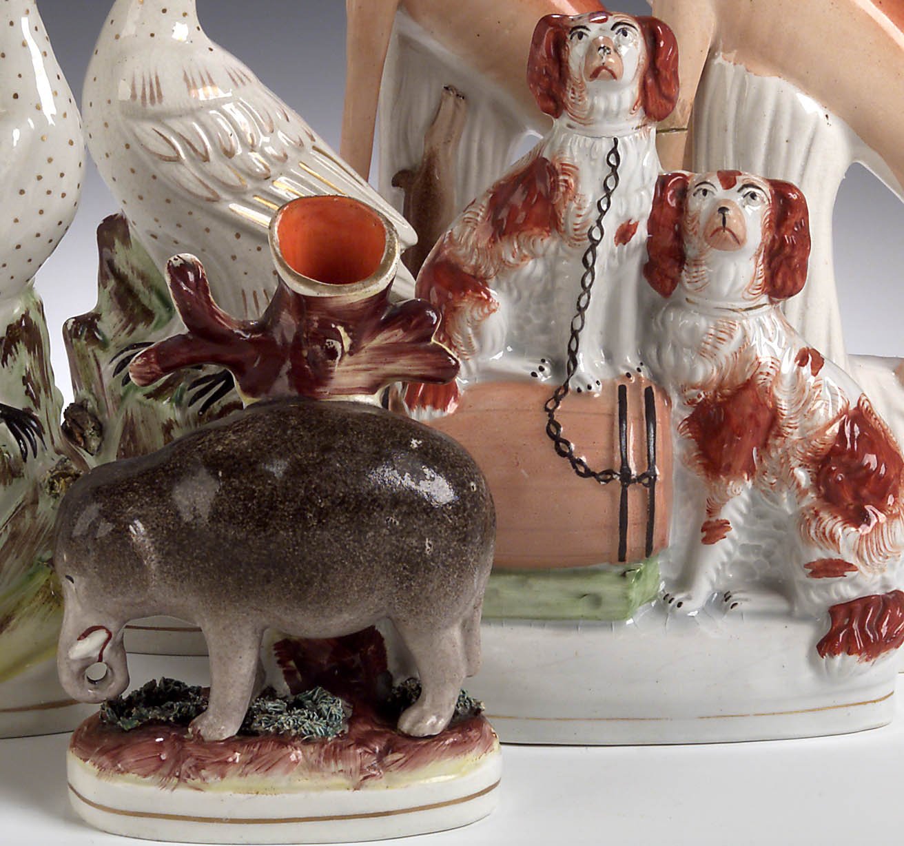 A mid 19th century Staffordshire elephant spill vase