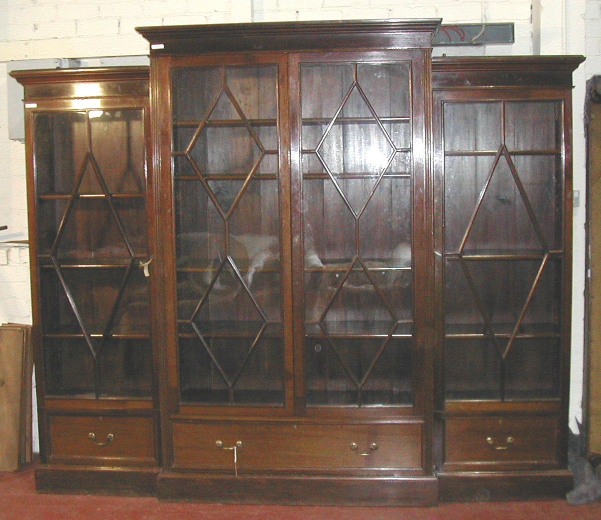 An early 20th century mahogany breakfront bookcase,
