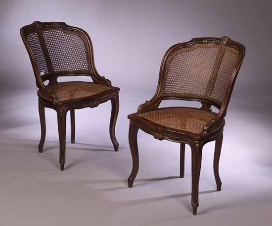 A set of four Louis XV style walnut chairs