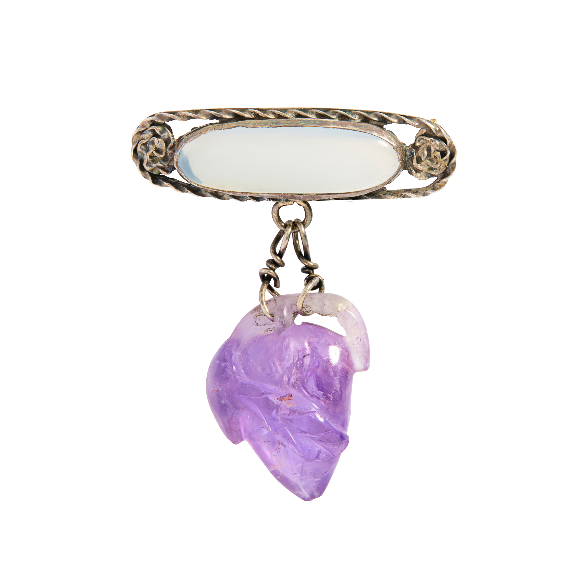 A carved amethyst and moonstone brooch