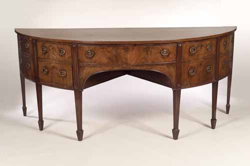A George III mahogany demi-lune sideboard,