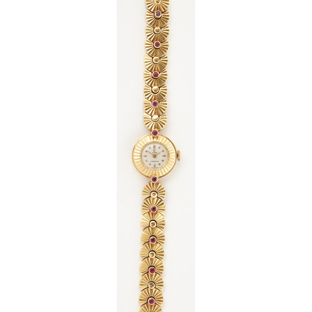 An 18ct gold and ruby set lady's wrist watch, Cyma