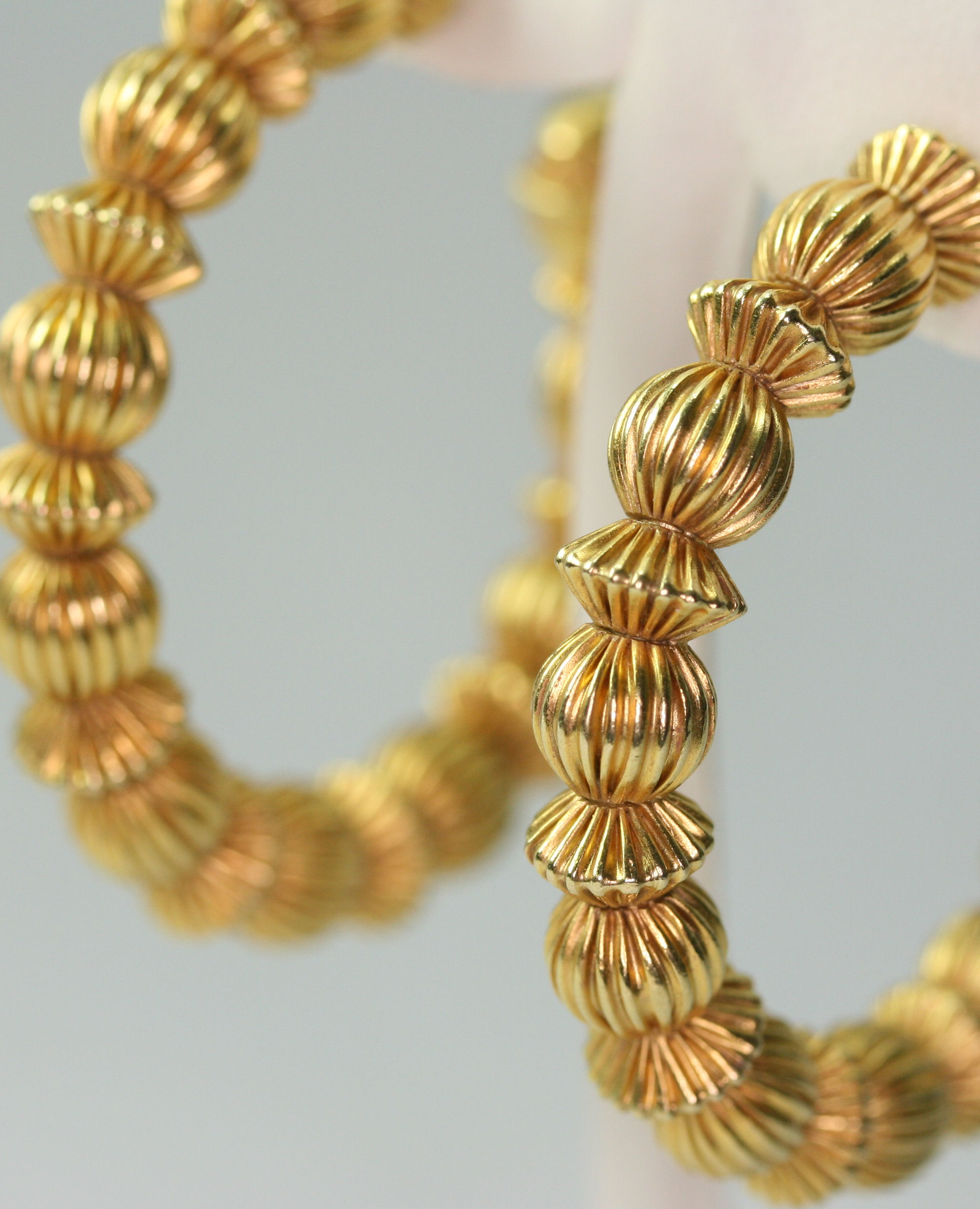 A pair of 18ct gold Creole style earrings, probably by Ilias Lalaounis