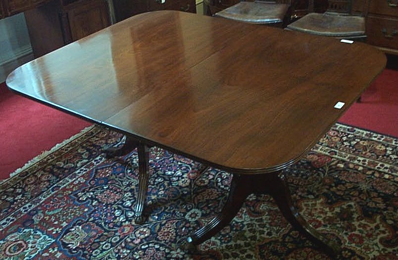 An Edwardian mahogany twin pedestal dining table,