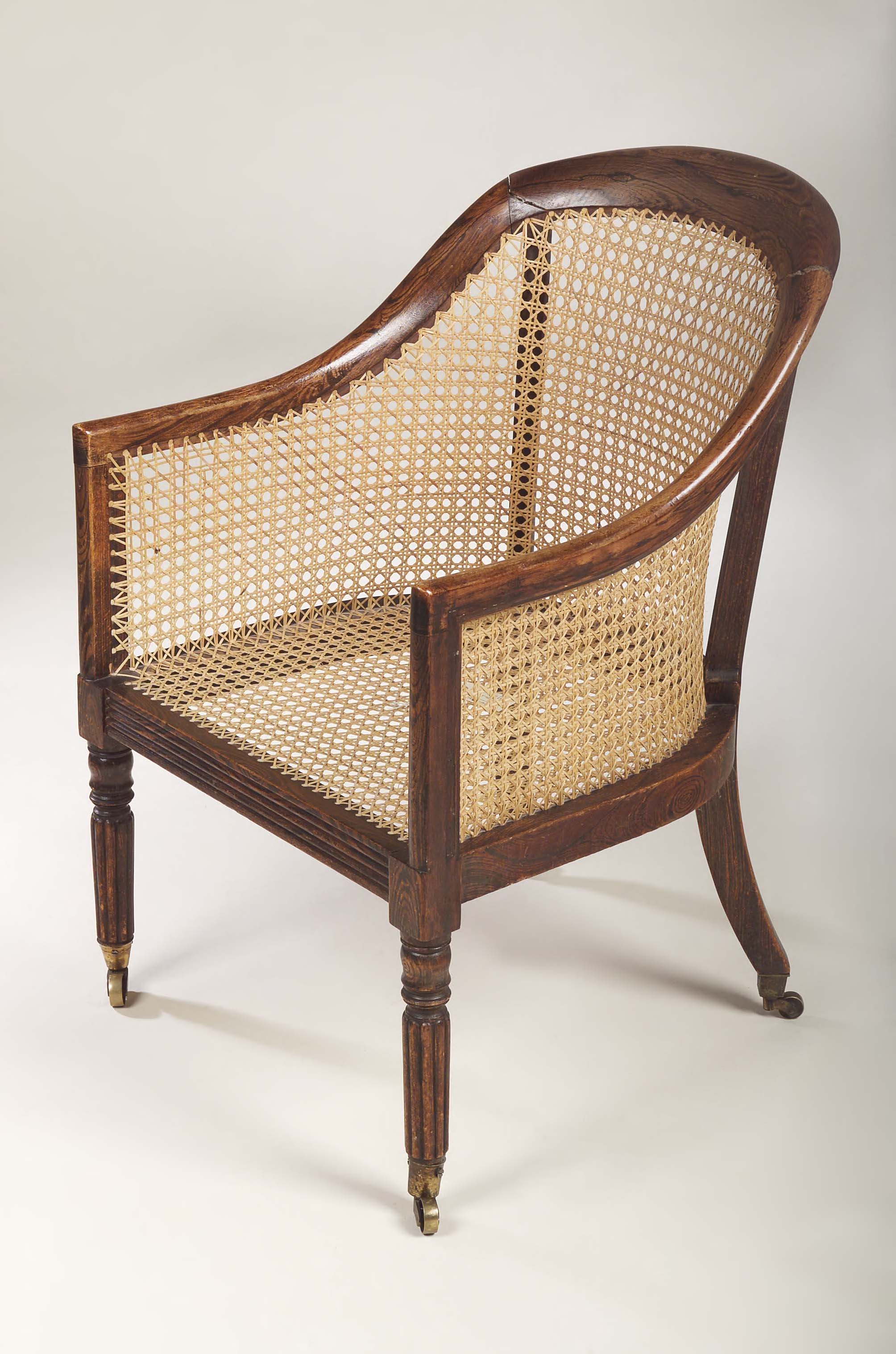 An early 19th century simulated rosewood library chair,