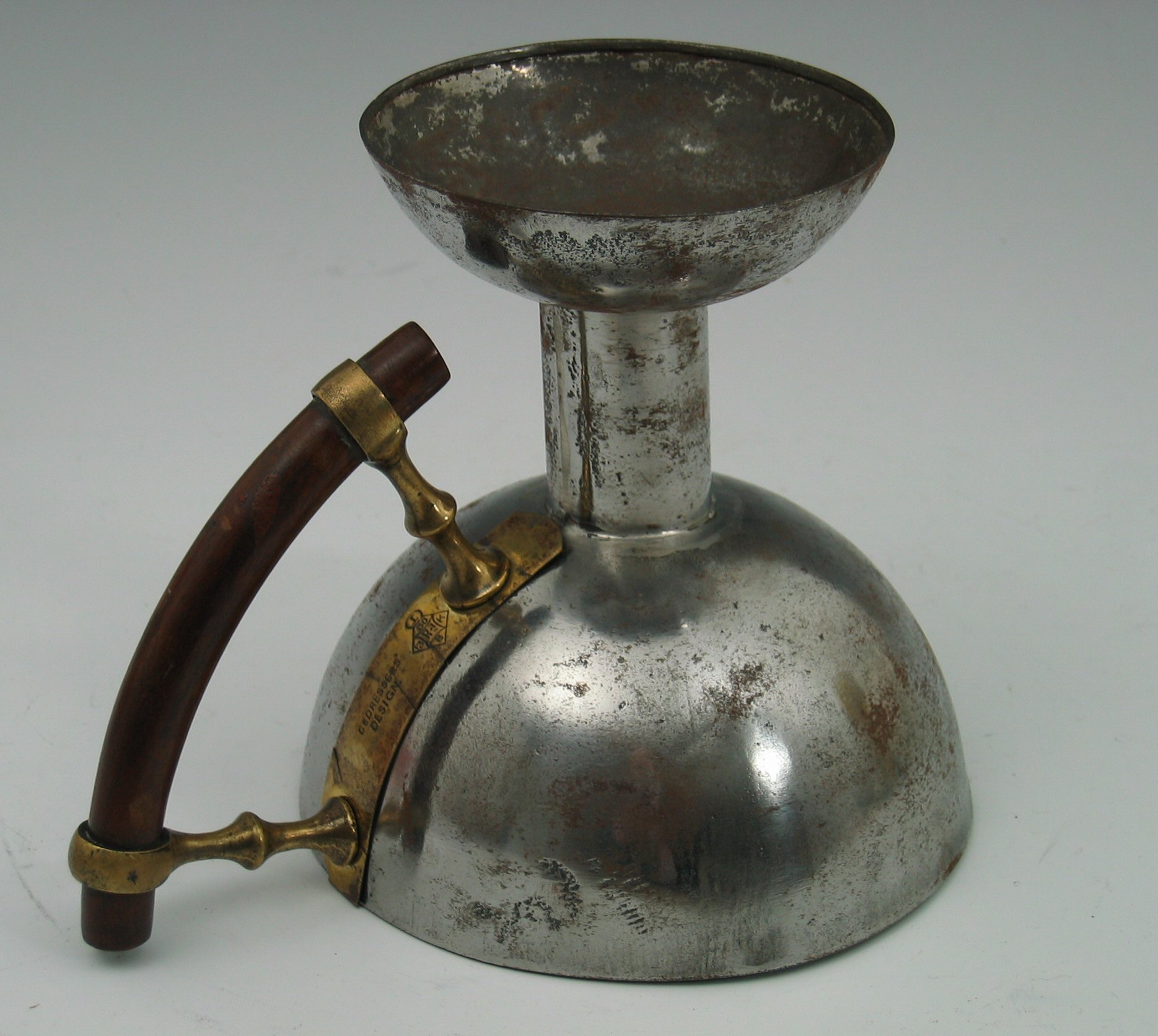 A 'Kordofan' chamber candlestick designed by Christopher Dresser,