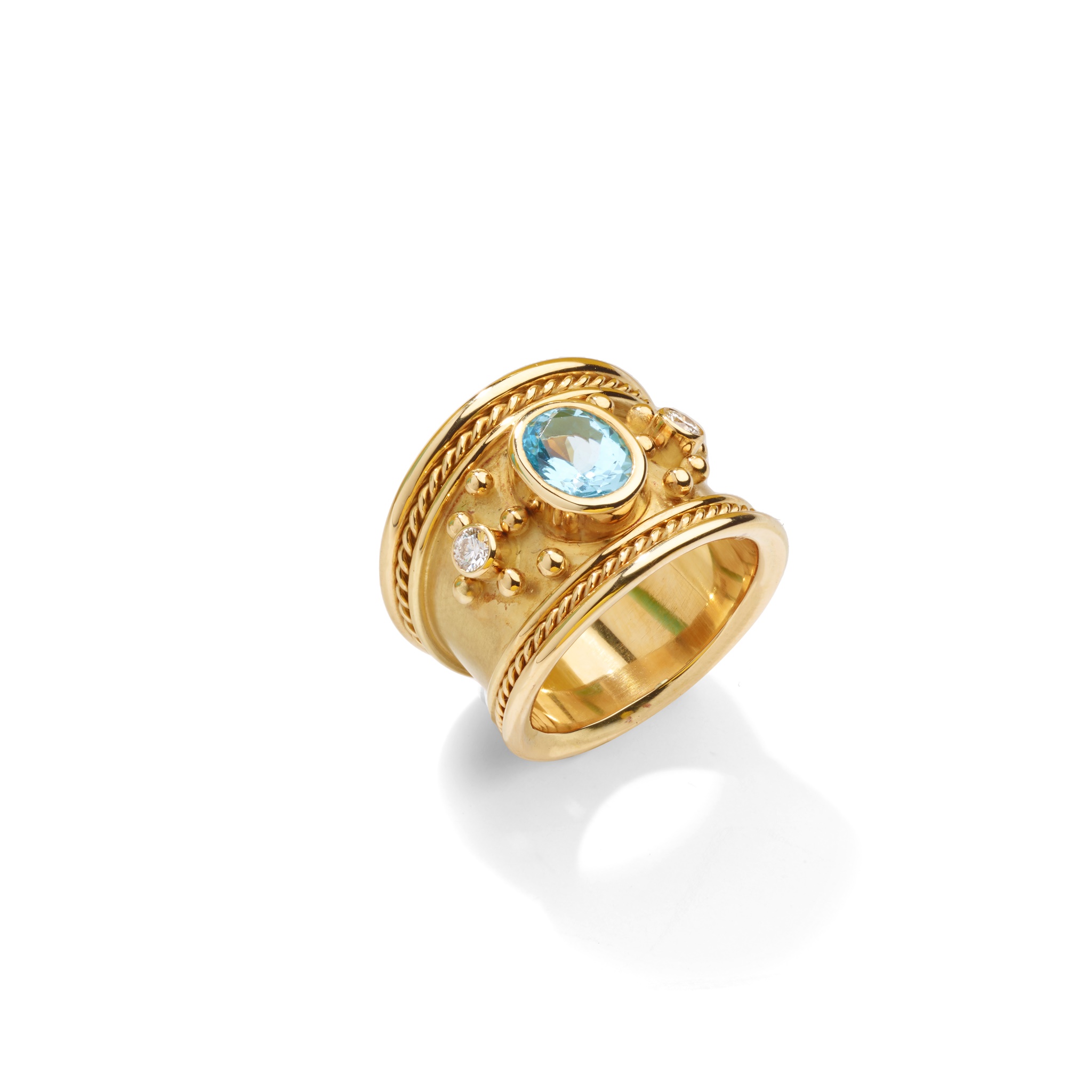 A topaz and diamond dress ring