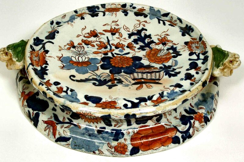 An early 19th century ironstone cheese stand