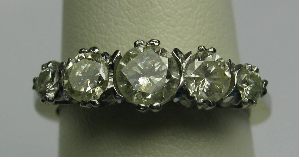 A platinum mounted five-stone diamond ring