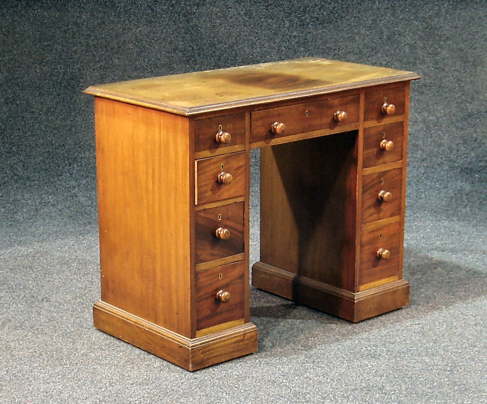 A Victorian mahogany kneehole desk