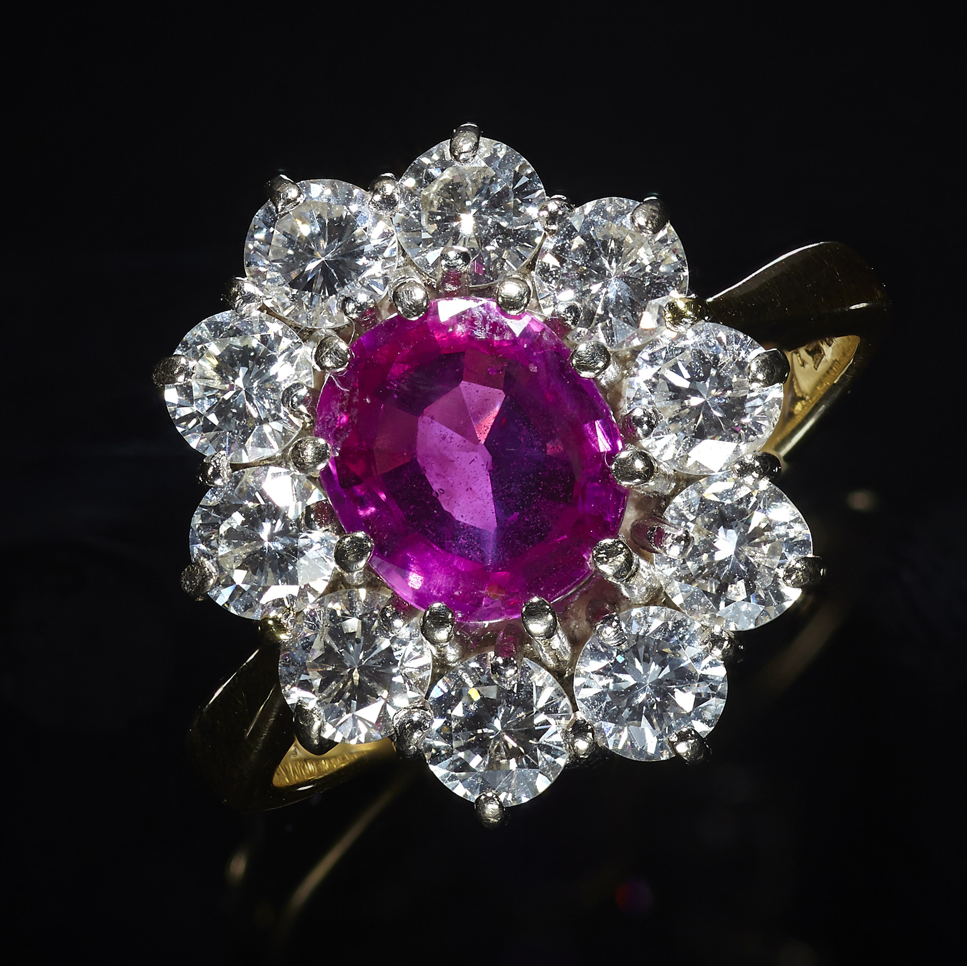 An 18ct gold mounted ruby and diamond cluster ring