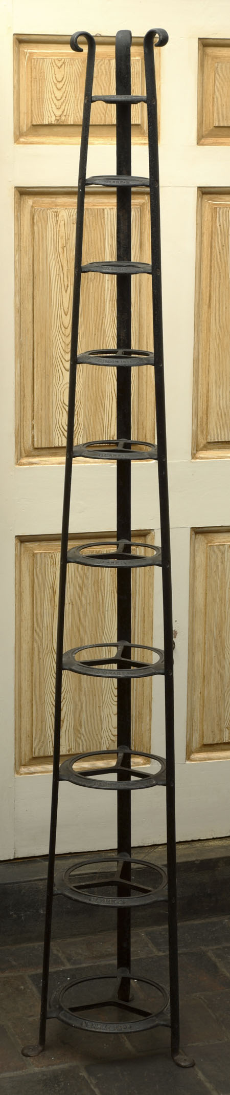 A Victorian cast iron measures stand