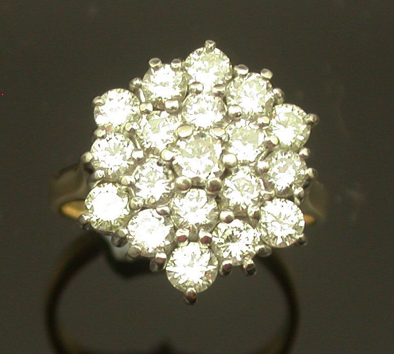 An 18ct gold mounted diamond cluster ring,