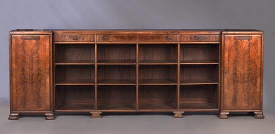 An early 20th century low walnut bookcase cabinet