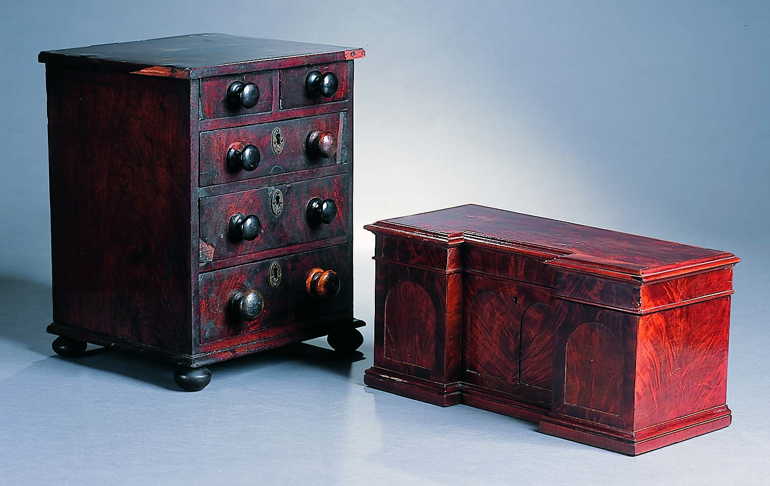 A 19th century mahogany tea caddy in the form of a miniature sideboard