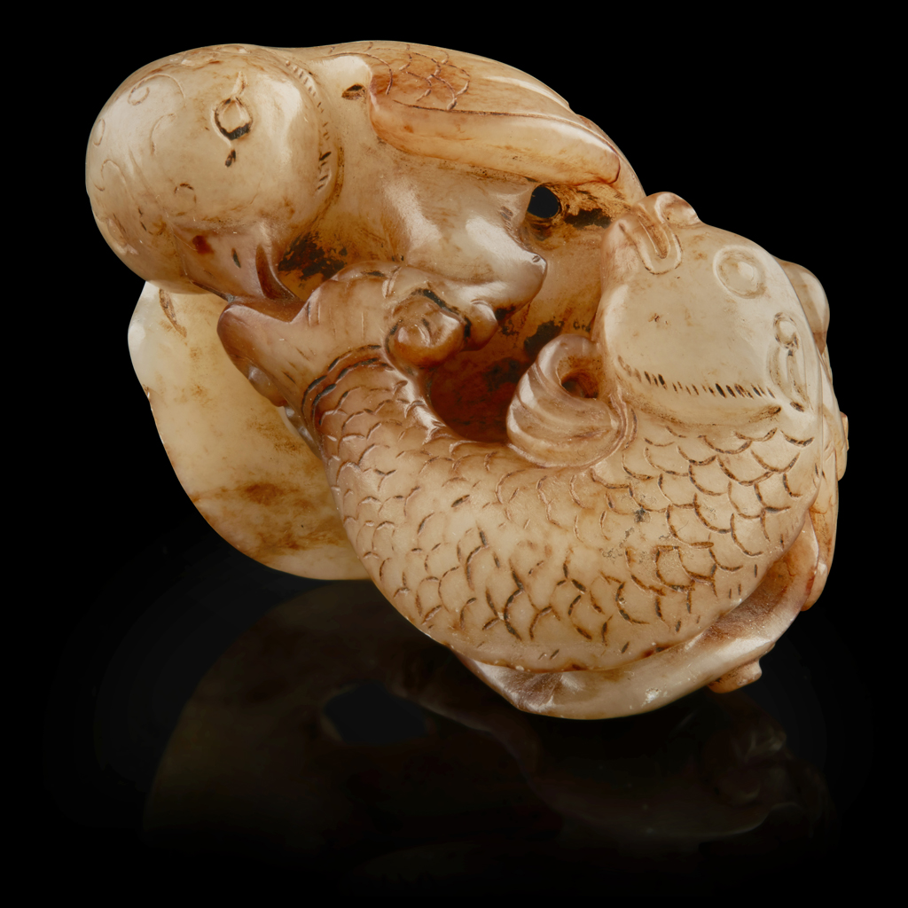 JADE CARVING OF AN OWL CATCHING A CARP