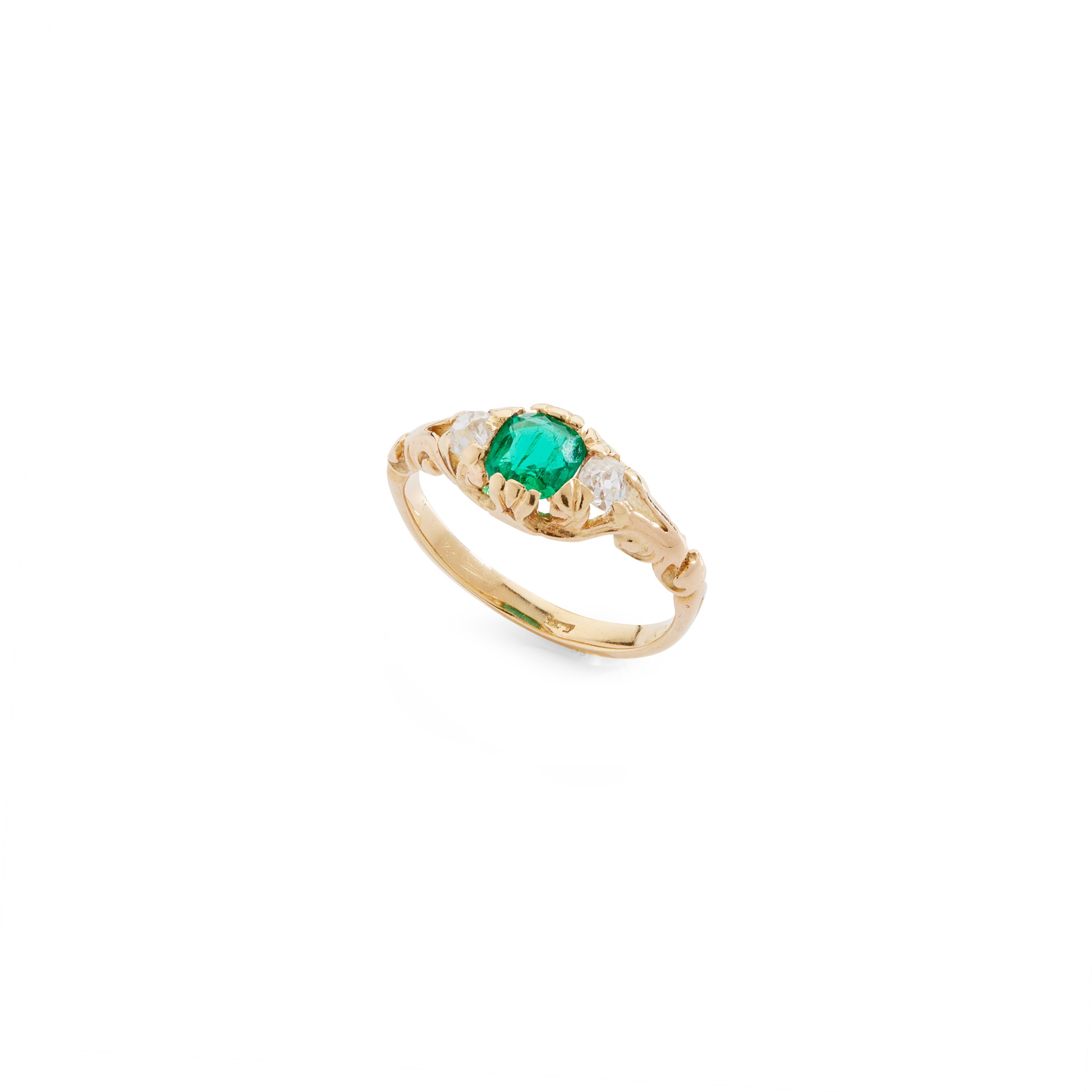 An emerald and diamond ring