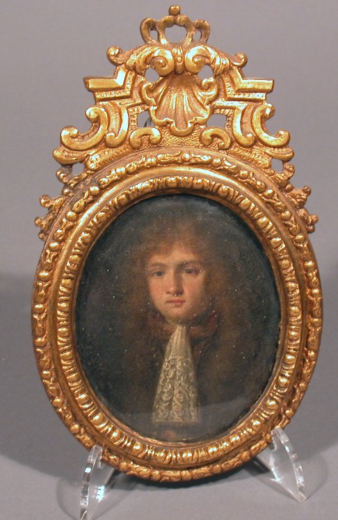 A pair of overpainted portrait miniatures