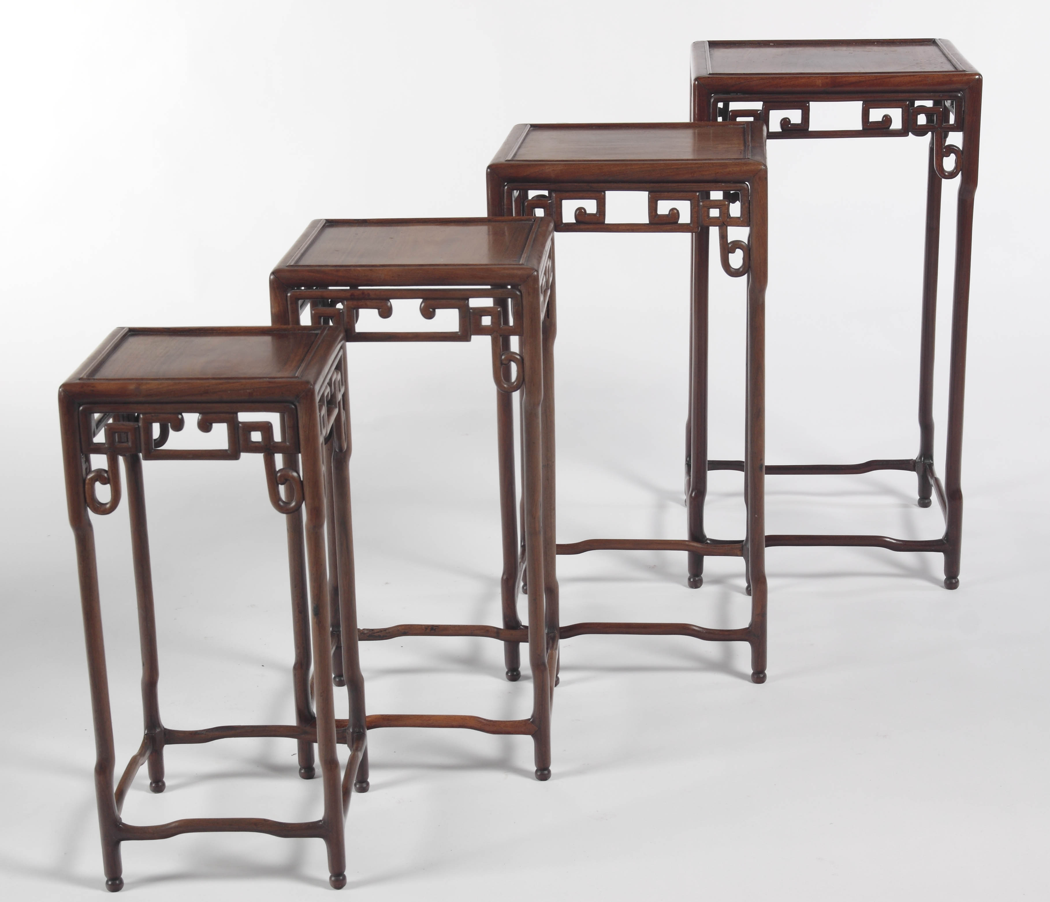 A 19th century Chinese huang huali nest of four tables