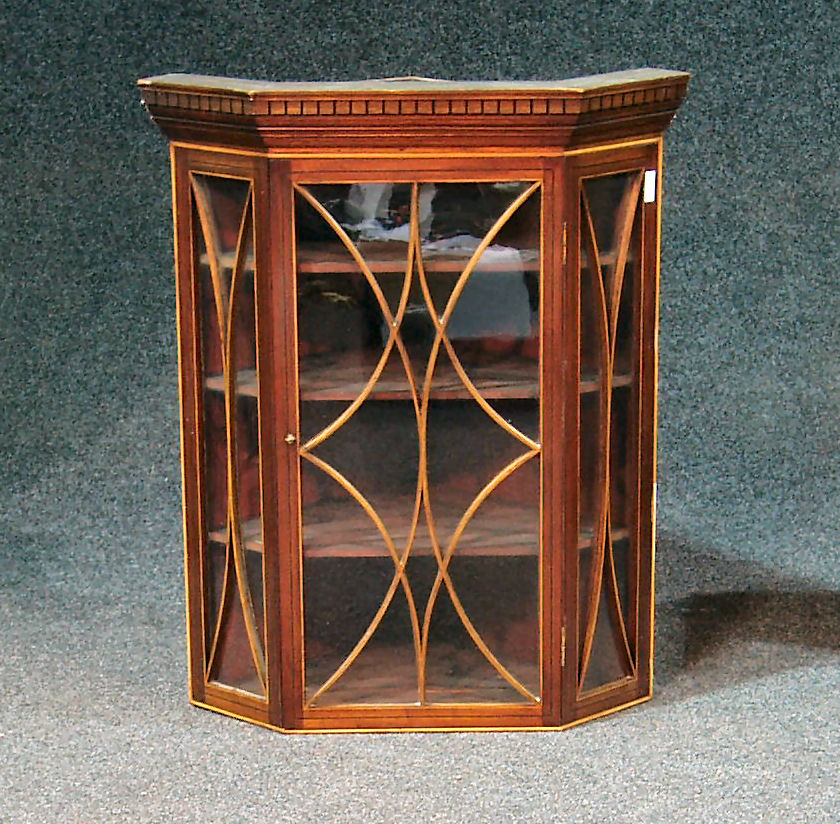 An Edwardian mahogany corner cabinet,