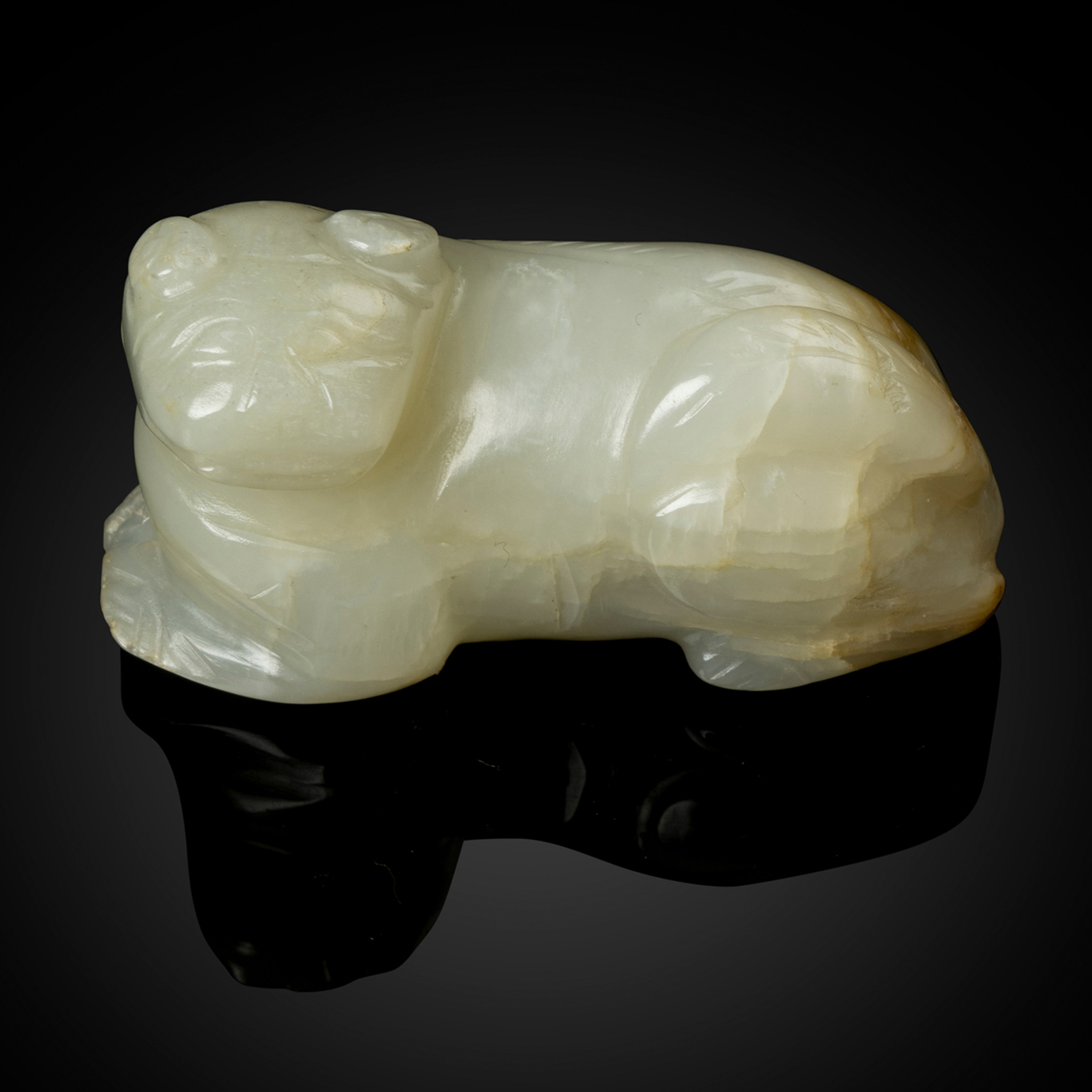 CHINESE WHITE JADE CARVING OF A RECUMBENT LION