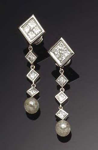 A pair of platinum mounted diamond pendant earrings,