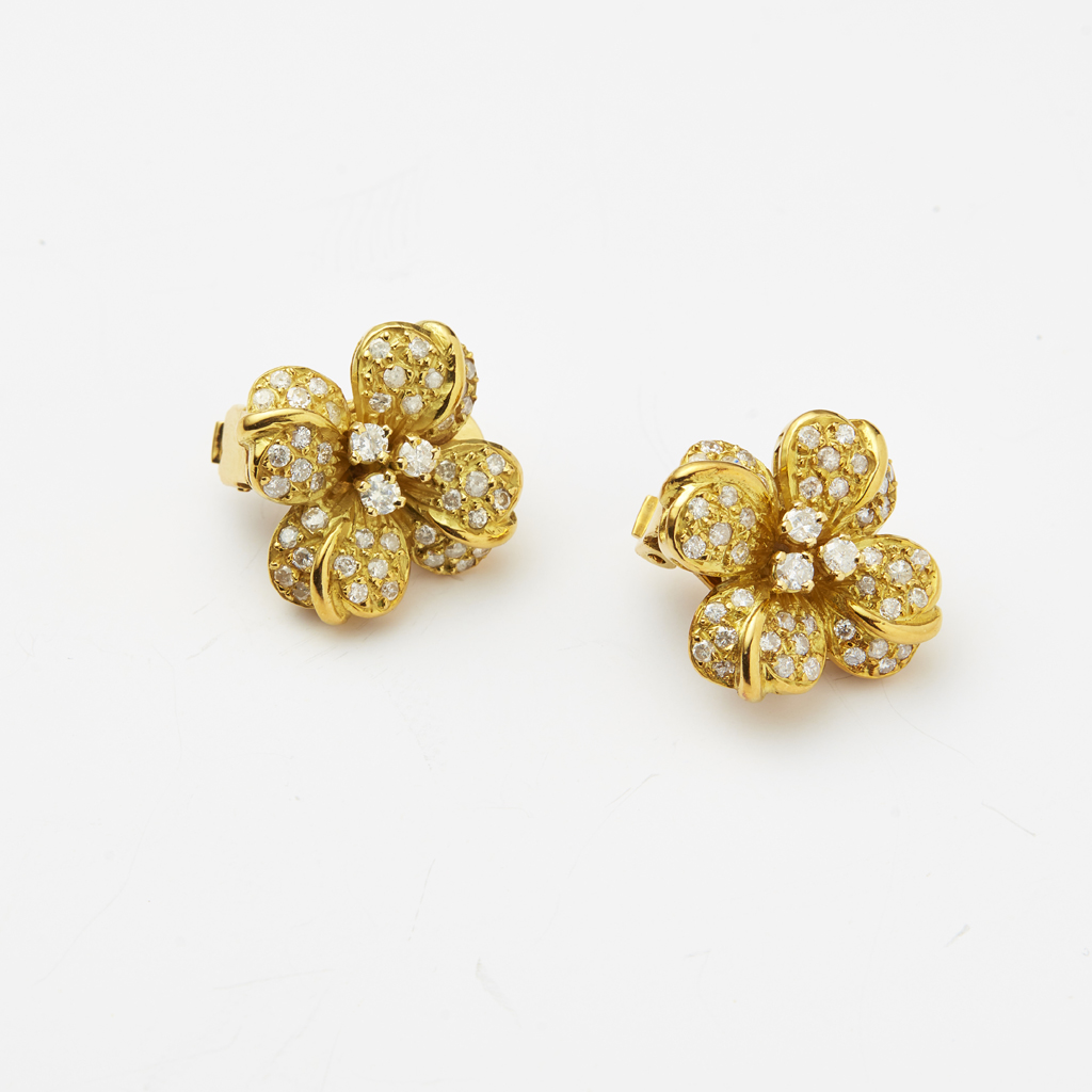 A pair of diamond set floral earrings