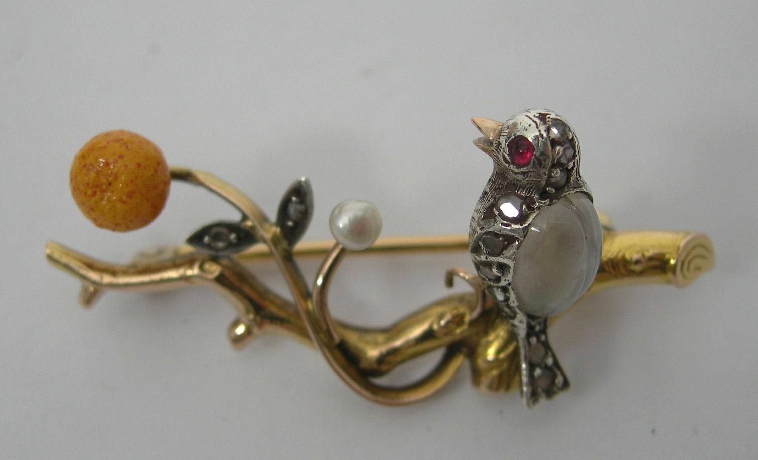 An Edwardian gem set bar brooch,