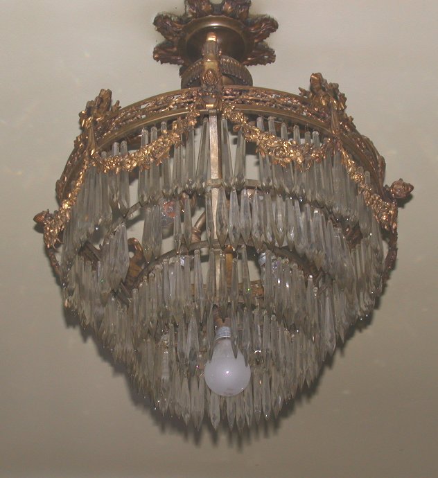 A gilt metal and cut glass four tier chandelier