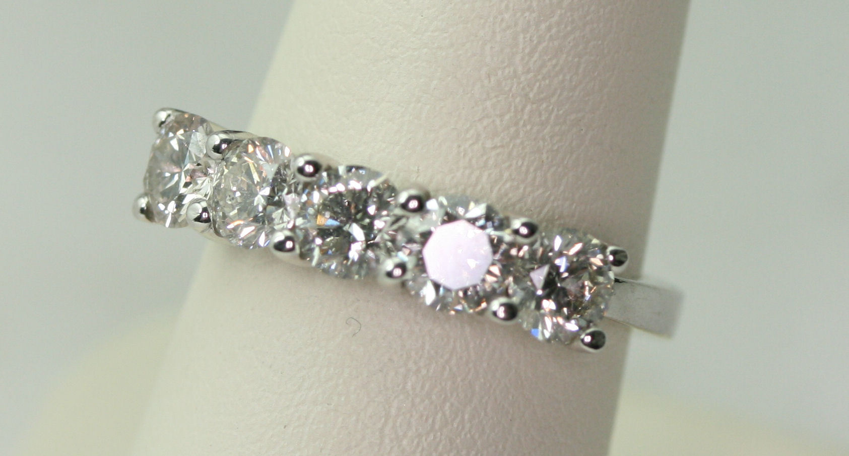 An 18ct white gold mounted five stone diamond ring