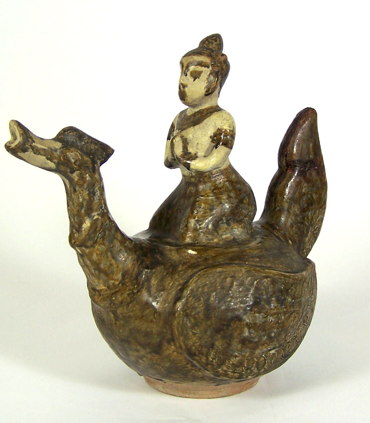 A 15th/16th century Thai pottery figure riding a kinnara, Sawankhalok period