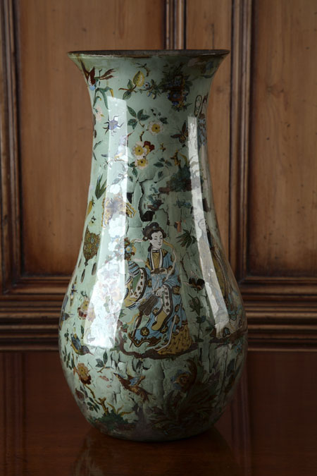 An elongated baluster decalcomania vase