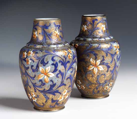 A pair of continental enamelled squat baluster vases