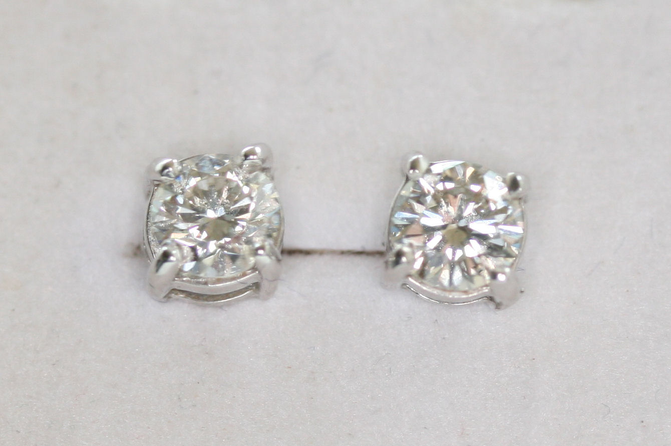 A pair of 18ct white gold mounted diamond ear studs