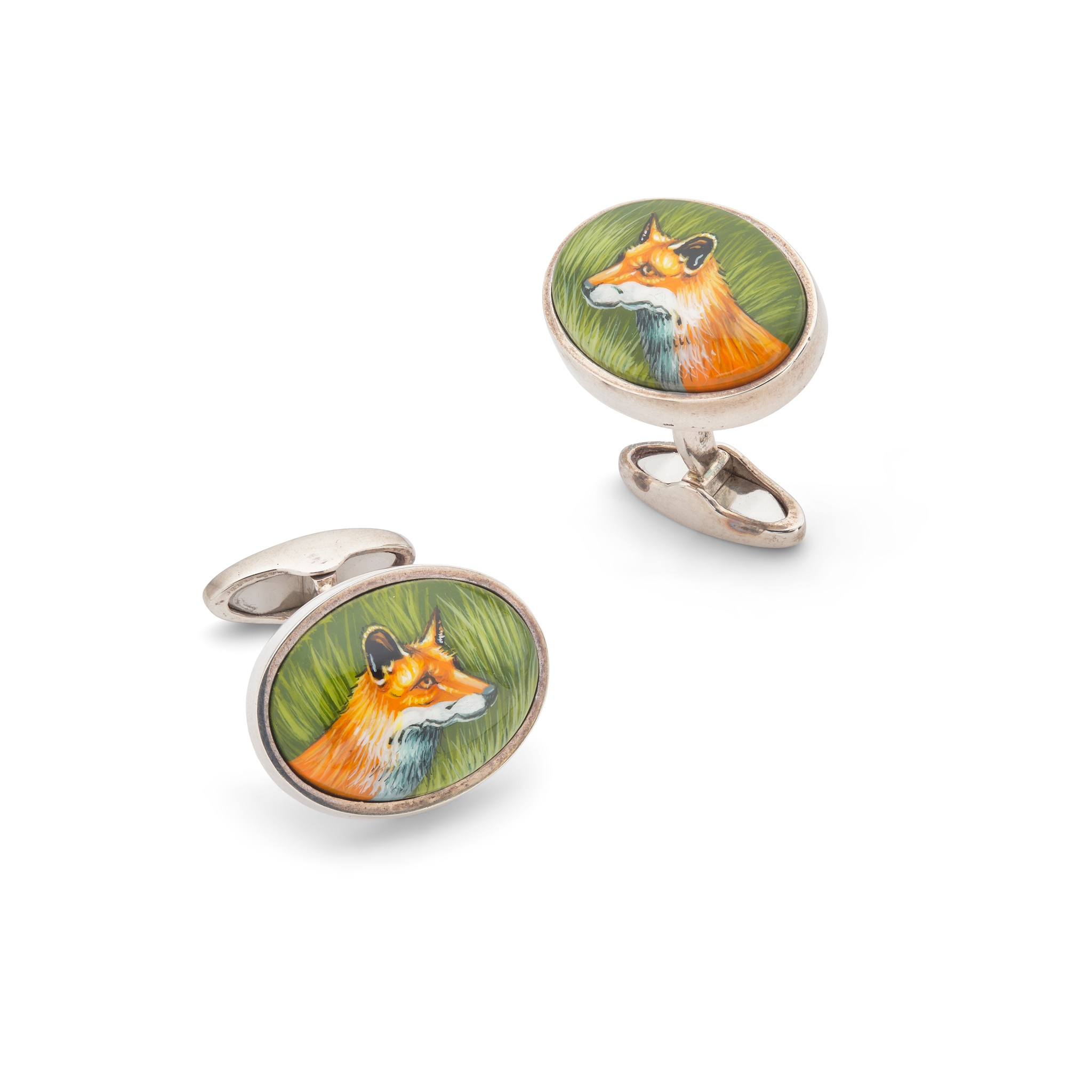 A pair of silver and enamel 'fox' cufflinks